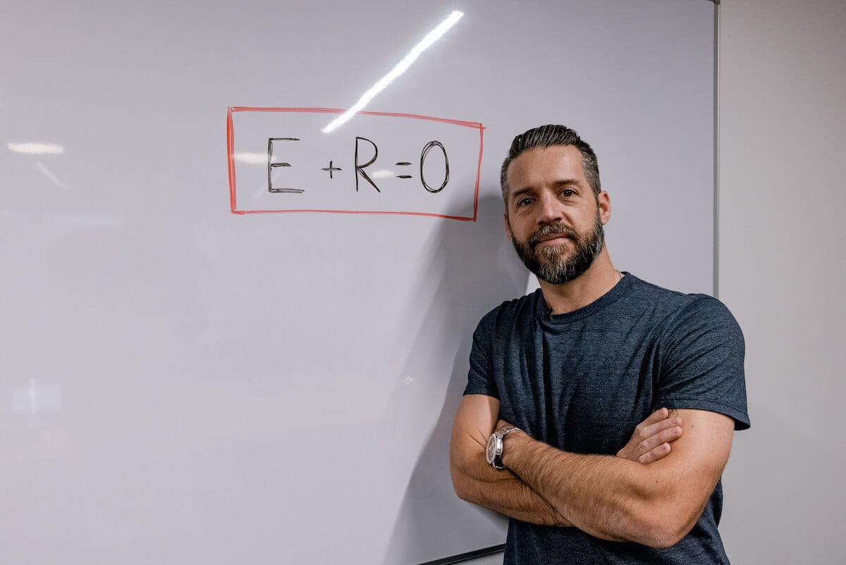 Brian Kight Teaching E+R=O on a whiteboard